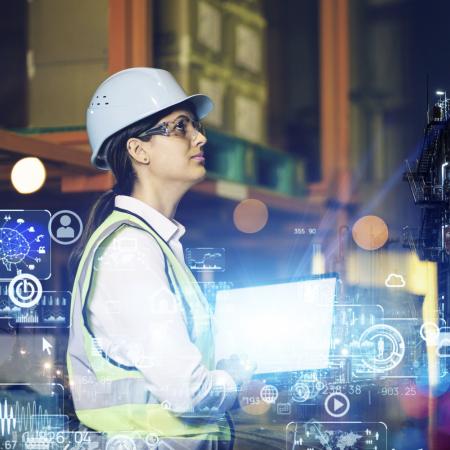 Female industrial engineer holding a tablet with Iot imagery